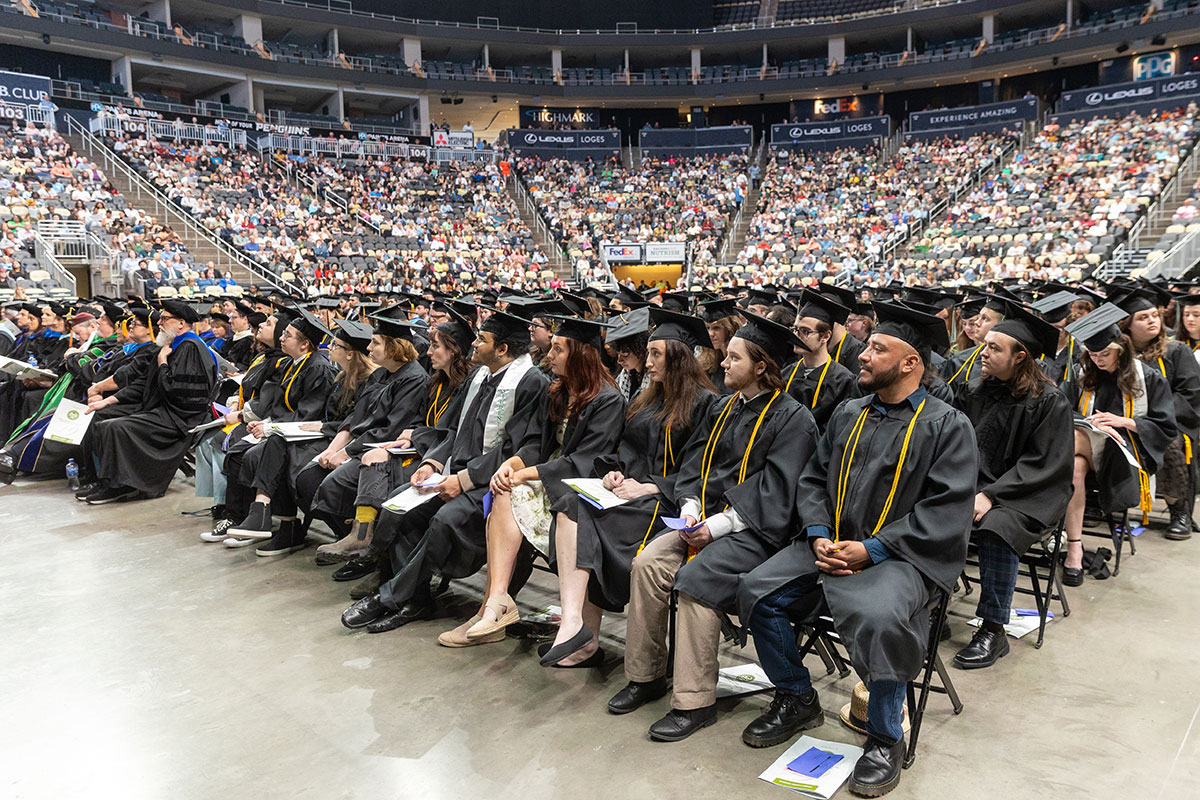 A group of graduates in an arena