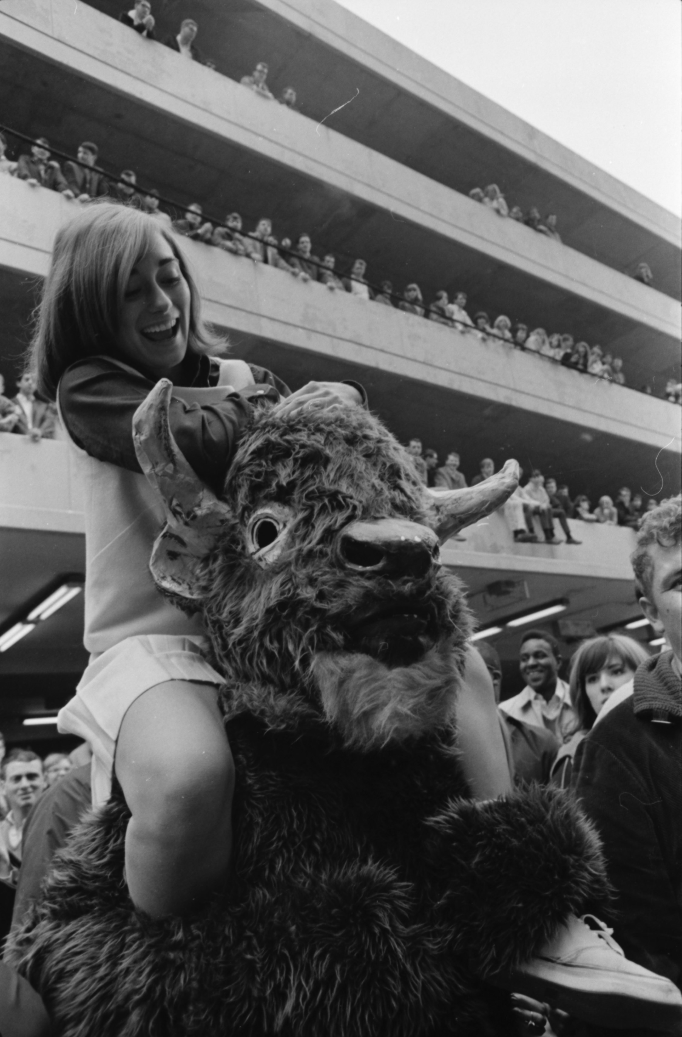 Cheerleader Janalyn Haas class of 1970 and Black Diamond at a Pep Rally on Third Avenue.