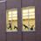 Students are seen through the windows of the dance complex on campus.