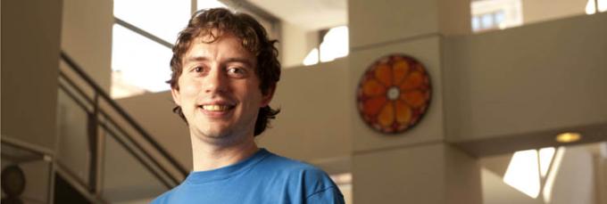 Portrait of electrical engineering technology graduate Joseph Reutzel in the lobby of Academic Hall. | Photo by Jim Judkis