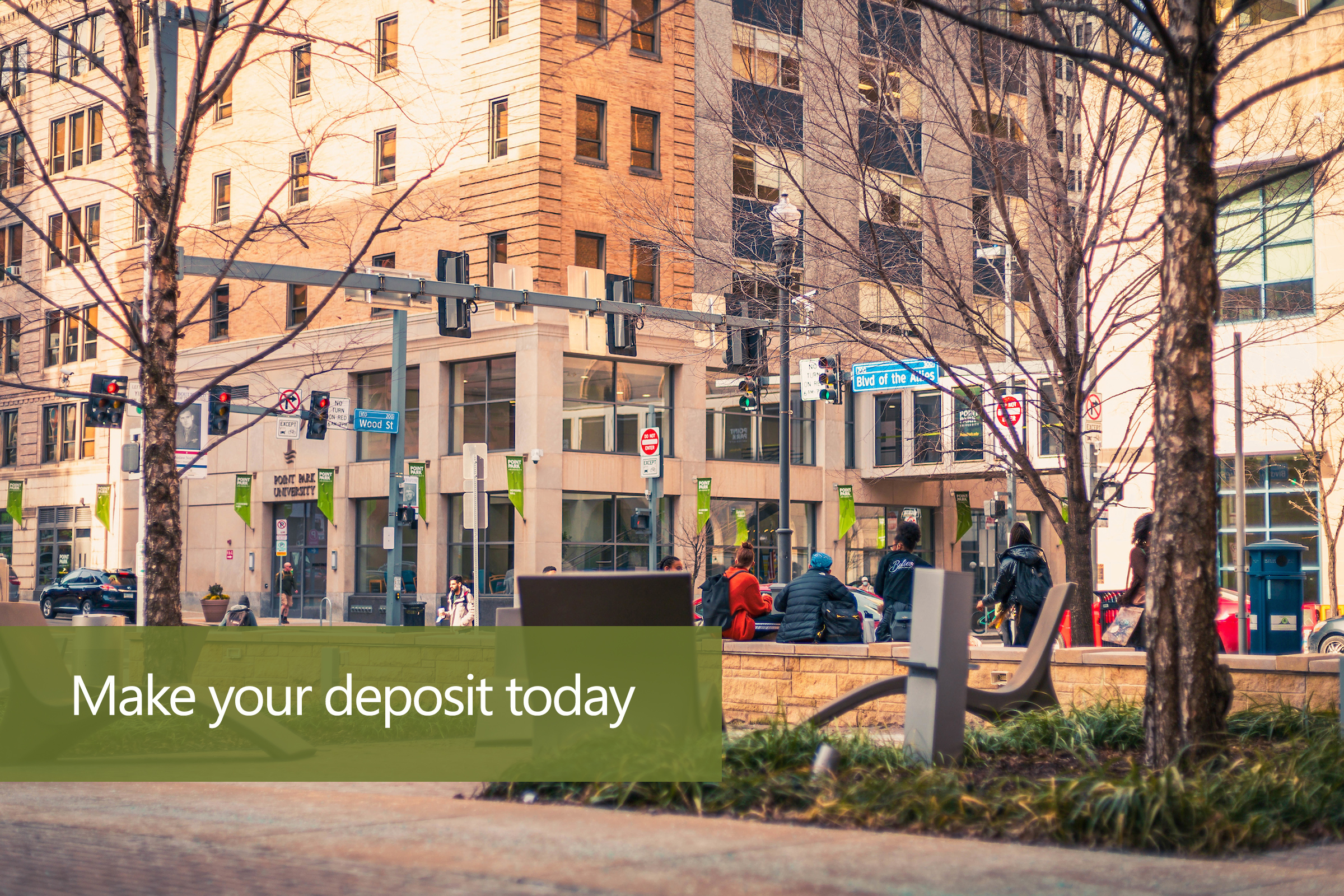 Photo of students walking through Village Park with a caption that reads "Make your deposit today"