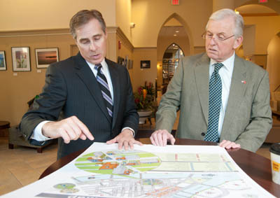 University President Paul Hennigan gives details of Point Park's Academic Village Iniaitive to state Auditor General Jack Wagner during a campus visit in February, 2012. | Photo by Christopher Rolinson