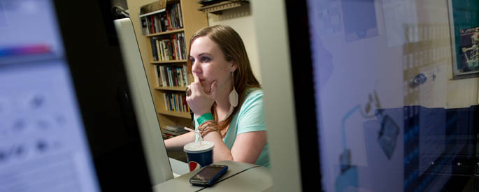 Pictured is a Point Park student working independently at a computer. | Photo by McKeith