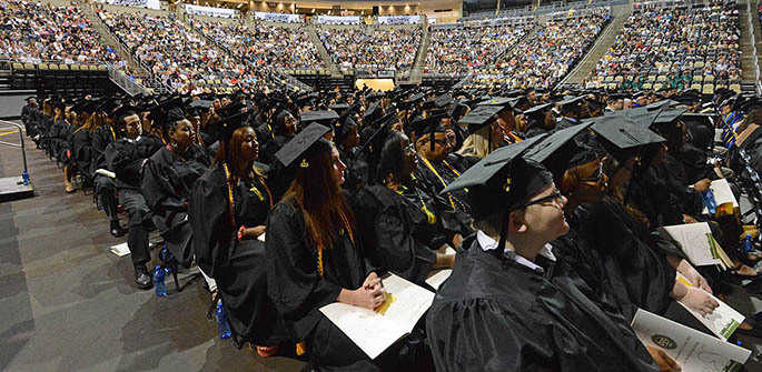 Point Park graduating seniors listen to commencement speakers during 2013 graduation ceremonies at the Consol Energency Center May 4. 