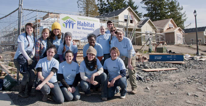 Point Park students and staff members pose for a group shot at the Habitat for Humanity work site near Tacoma, Wash.