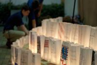 For the candlelight vigil to remember the 9/11 victims, students decorated white bags that became luminaria for the ceremony. | Photo by Matthew Brudnok