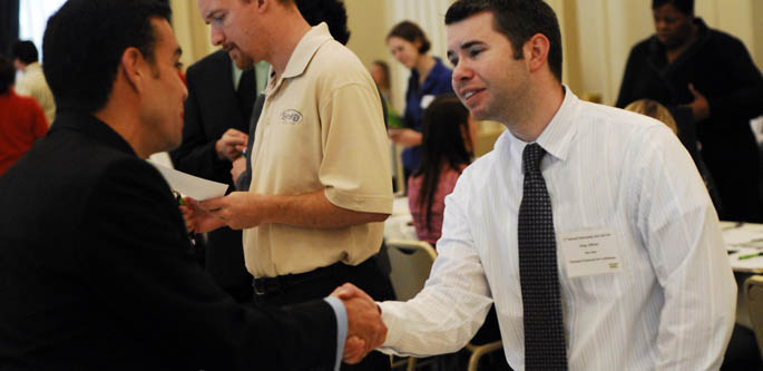 A Point Park student and a prospective student shake hands at the 2010 Internship and Job Fair. | Photo by Christopher Rolinson