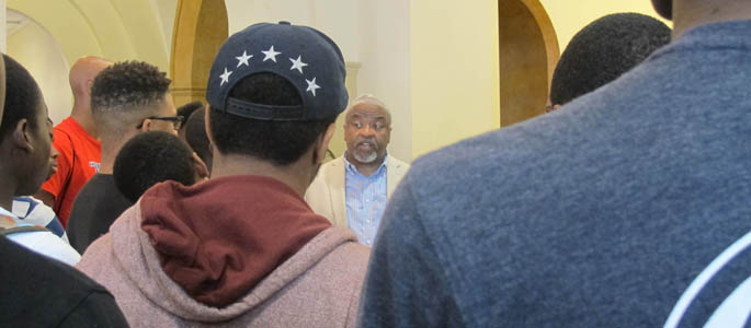 Point Park Education Professor Stanley Denton, Ph.D., talks with high school students at the 2015