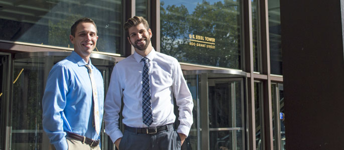 Pictured are M.B.A. alumni and UPMC employees Joseph Veltri and Benjamin Eonta. | Photo by Shayna Mendez
