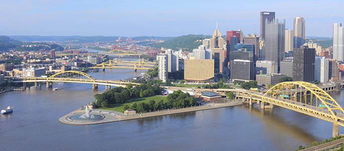 Photo of Downtown Pittsburgh and Point State Park, showing the city skyline and the three rivers. iStock photo.