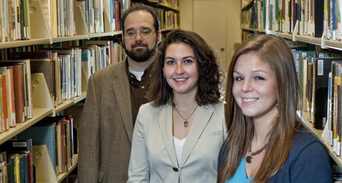 Assistant Professor Brent Robbins with psychology majors Meghan Higgins and Katie Over, who co-authored a research paper along with fellow student Maureen Fisher. | Photo by Christopher Rolinson 