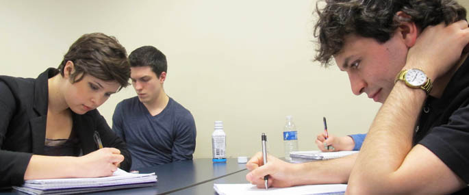 Students complete a writing assignment in a master class on campus. | Photo by Amanda Dabbs