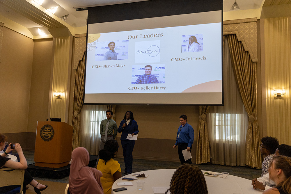 Students deliver a presentation on Cuts & Curls, a business they developed during ACAP. Photo by John Altdorfer.