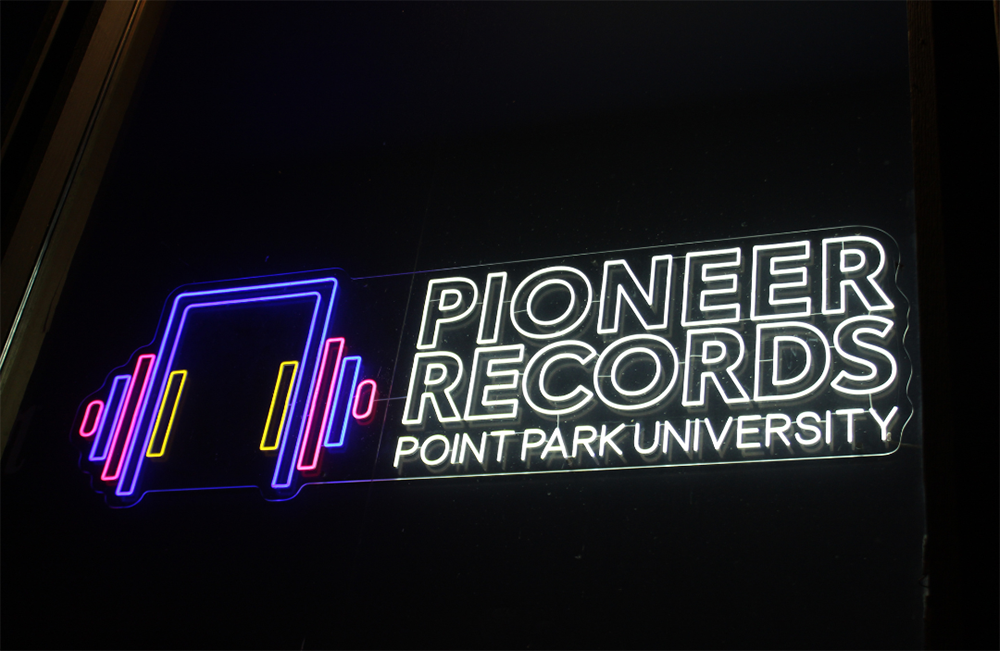 Pictured is a neon sign at the new Pioneer Records space at Point Park University. Submitted photo.