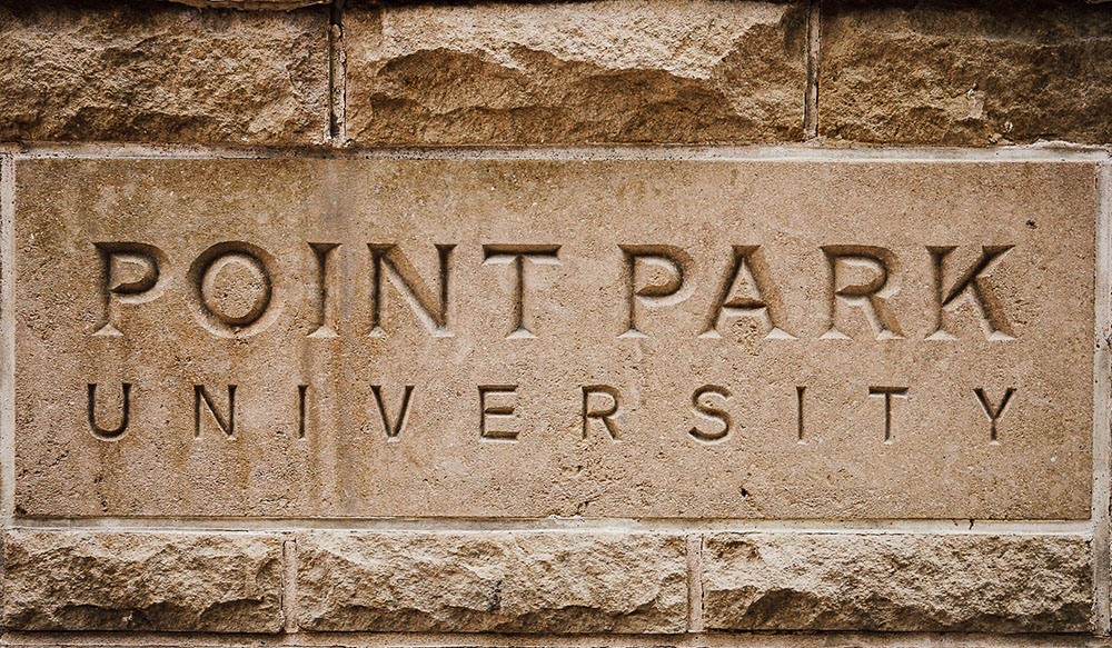 Pictured is brickwork engraved with the words "Point Park University." Photo by Nathaniel Holzer.