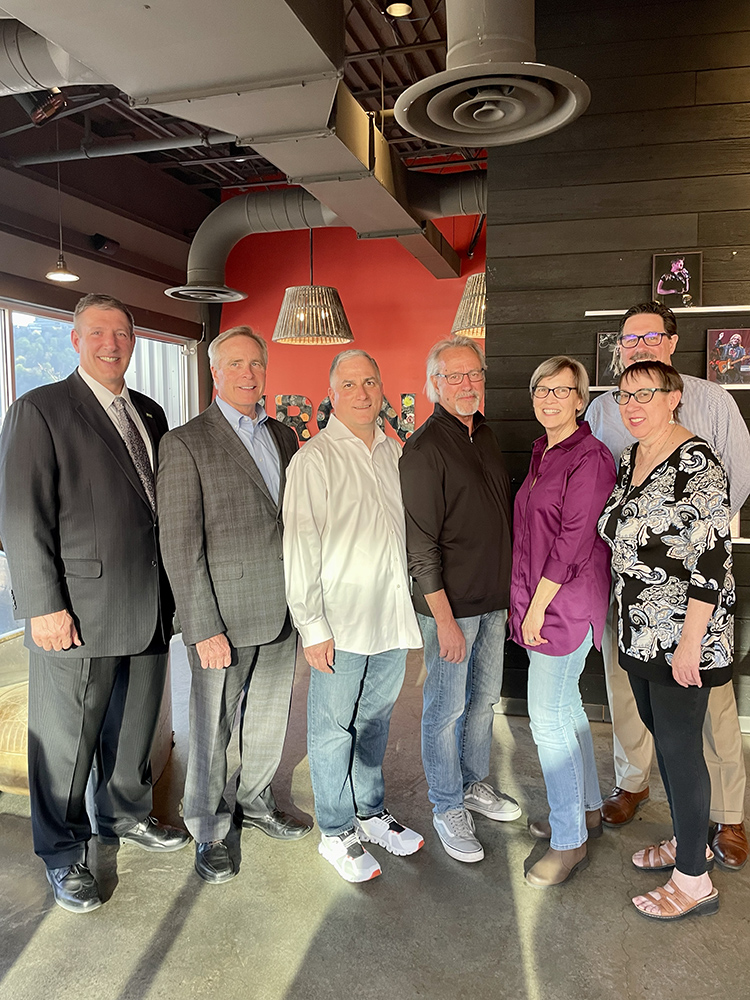 Pictured from left are Chris Brussalis, interim president, Paul Hennigan, president emeritus, Steve Tanzilli, dean of the Rowland School of Business and faculty Ed Traversari, Paige Beal, Robert Derda and Teresa Gregory.
