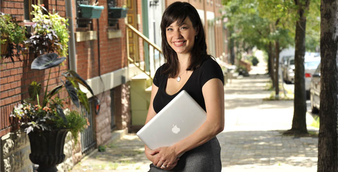 Jennifer Russell, a 2010 IMC grad who started her own marketing communications company, poses on Pittsburgh's North Side. | Photo by Jim Judkis 