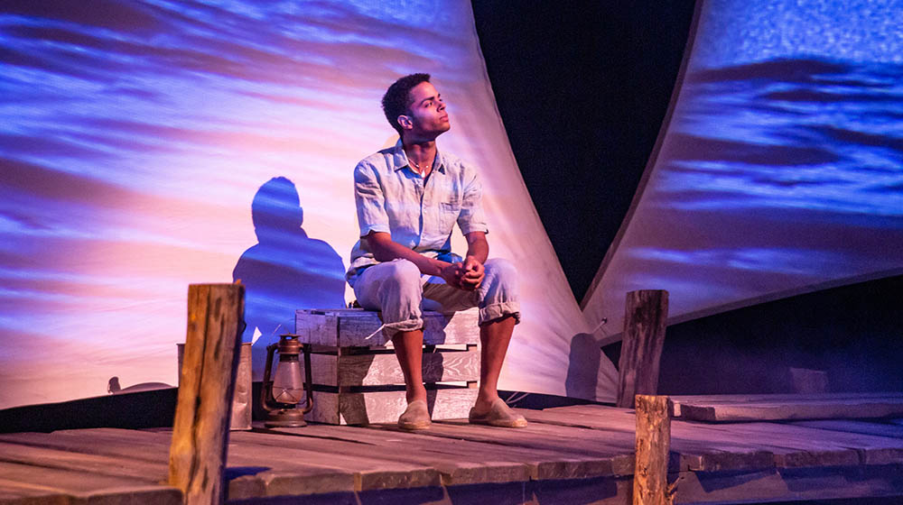 Gabriel Florentino as Manolin in the world premiere stage adaptation of The Old Man and the Sea . Photo | John Altdorfer