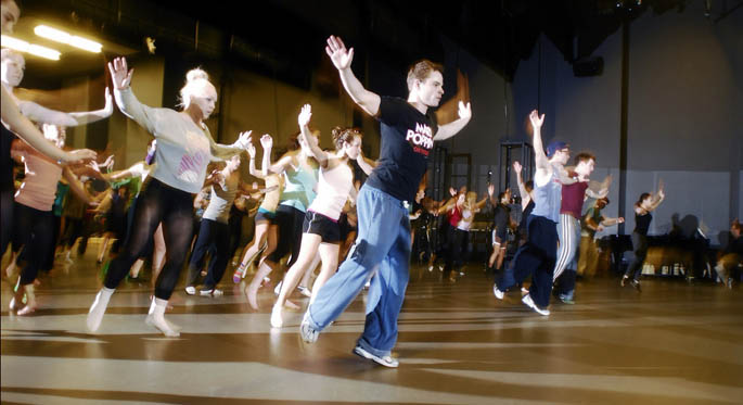 Point Park alums Case Dillard, 27, Shua Potter, 28, and Eric Hatch, 29, conduct a master class to teach current students dance numbers from the broadway show. | Photo by Christopher Rolinson