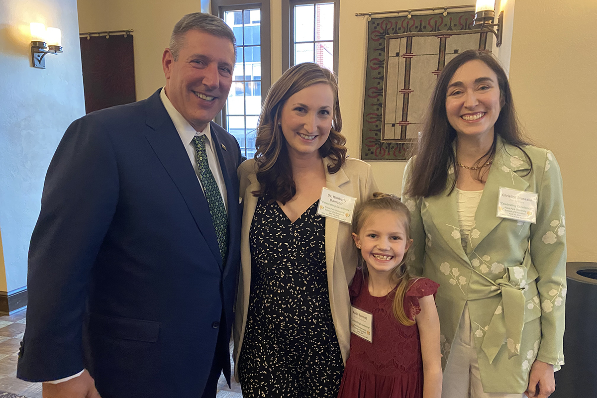 Pictured are President Chris Brussalis, Kimberly Damcott, Ed.D., Dr. Damcott's daughter and Christina Brussalis. Photo by Nadia Jones.