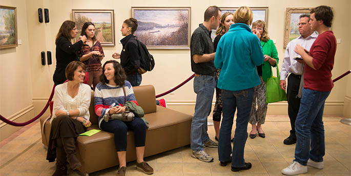 Point Park students and their families socialize in the Lawrence Hall Gallery as part of Family Weekend 2014.