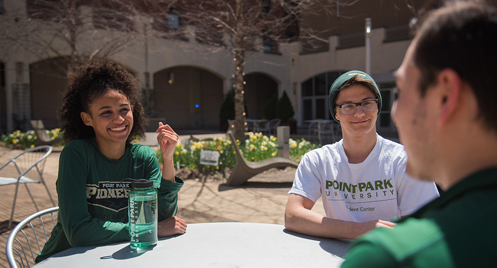 Pictured are Point Park students in Village Park. Photo by Nick Koehler.