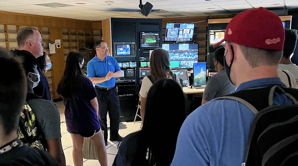 WTAE General Manager Chuck Wolfertz and Chief Engineer Paul Nowakowski show students the feeds and functions in the control room.