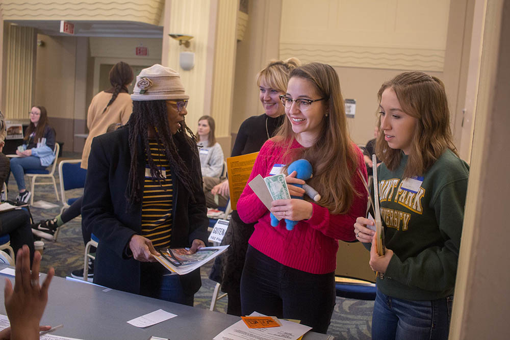 Students met with community resource providers during the poverty simulation event on campus.