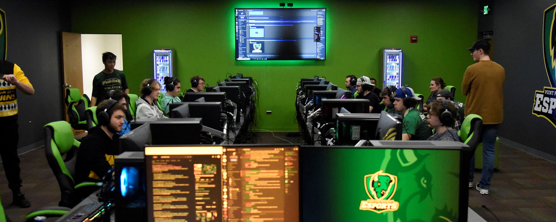 Students play video games in an esports facility.