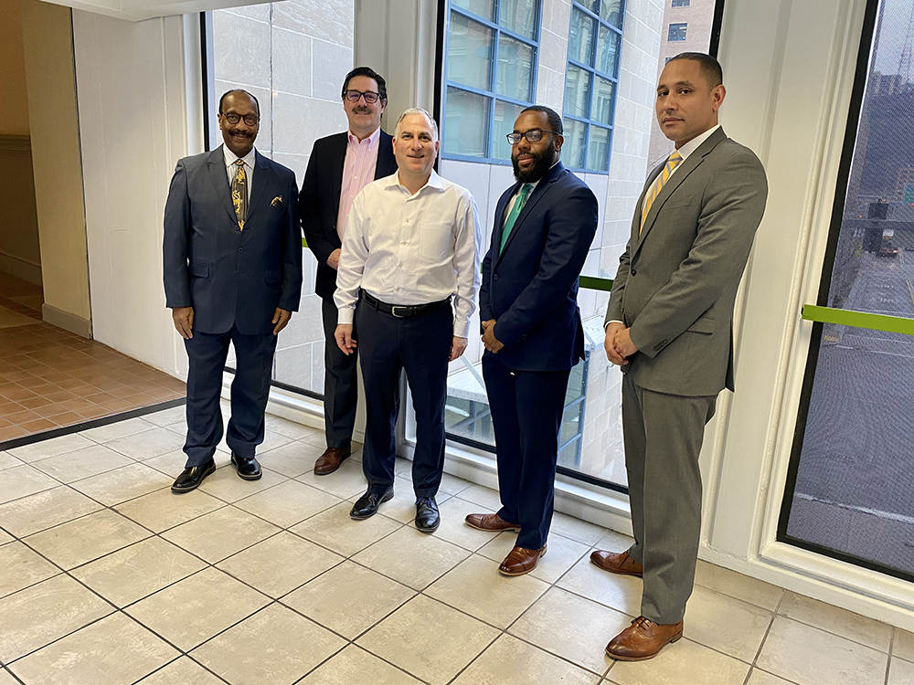 Pictured from left are Mitch Nickols, director of the Rising Brothers and Sisters program; Robert Derda, associate professor and chair of the SAEM program; Steve Tanzilli, dean of the Rowland School of Business; Jason Jones, vice president of community development at Dollar Bank and Morton Stanfield Jr., senior vice president of community development at Dollar Bank.