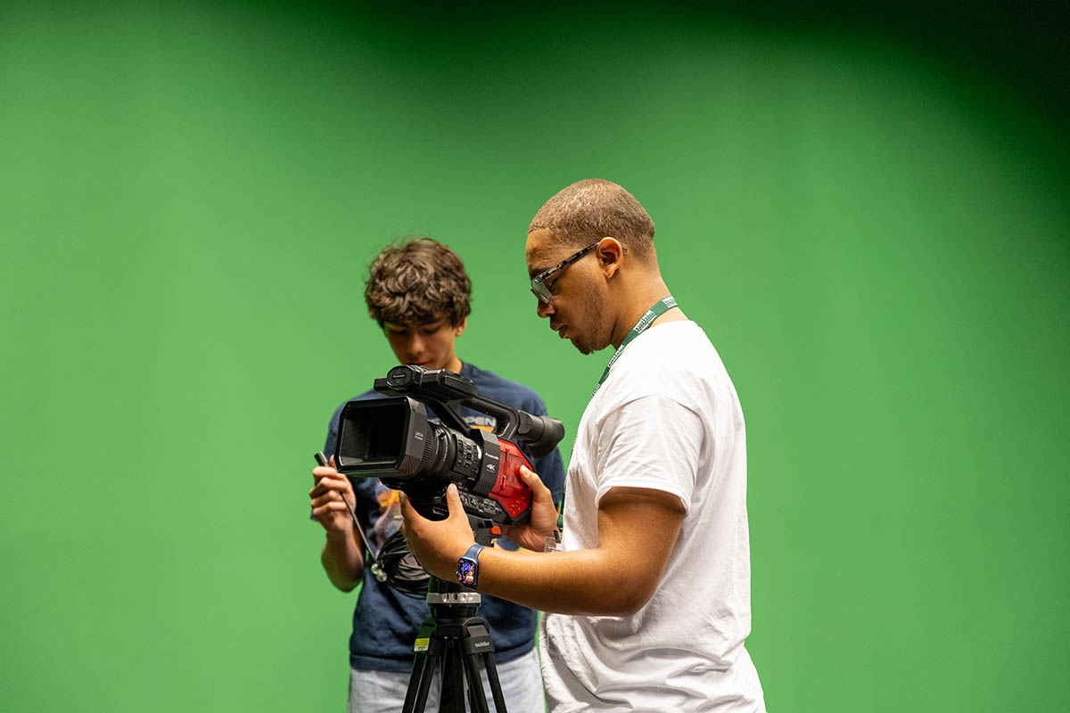 Students use a camera at Film Intensive.