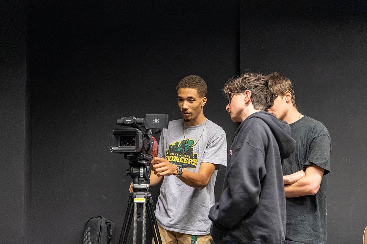 Students use a camera at Film Intensive.