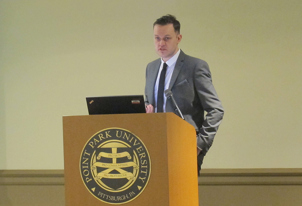 Pictured is Dr. Daniel Lomas presenting at Point Park University. Photo by Amanda Dabbs