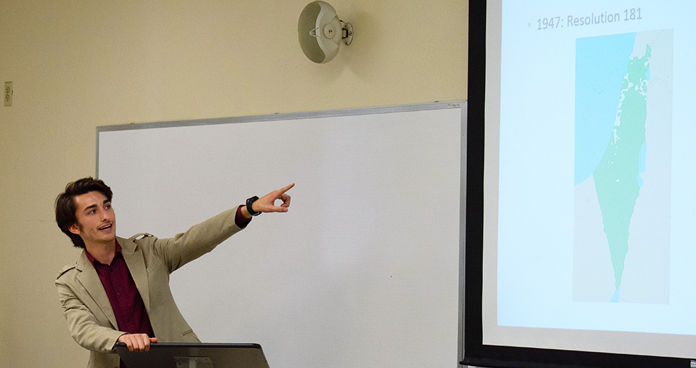 Pictured is a student presenting at the Ninth Annual Undergraduate Interdisciplinary Symposium, hosted by the Department of Literary Arts. Photo by Brandy Richey