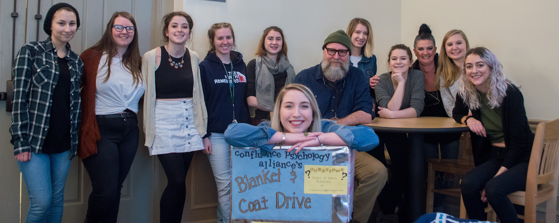 Pictured is the Confluence Psychology Alliance at a 2017 blanket and coat drive event.