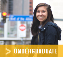 Pictured is a Point Park University undergraduate student sitting in Alumni Park. | Photo by Chris Rolinson