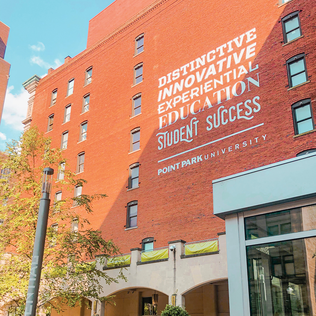 The exterior wall of boulevard apartments that borders Village Park