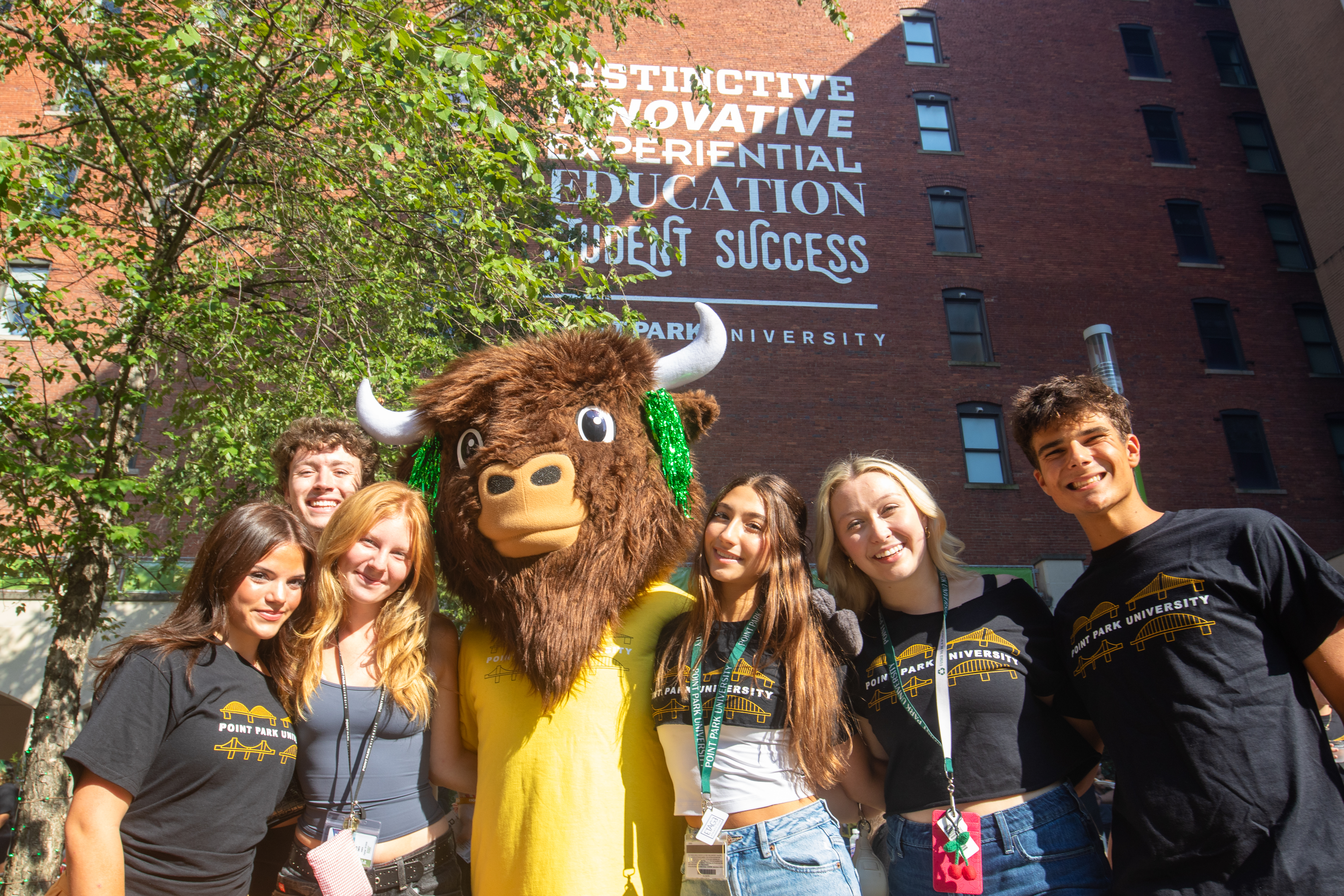 students with bison at orientation