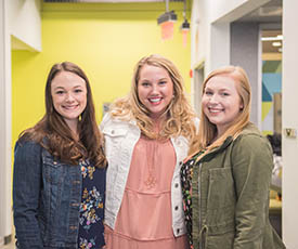 Lauren Joseph, Maggie McCauley and Caite Miller in the Center for Media Innovation. Photo | Nick Koehler