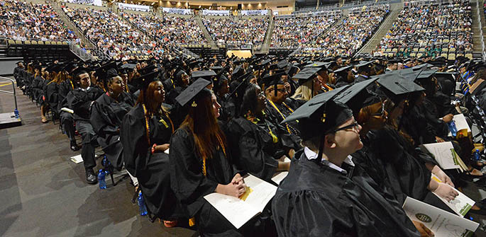 Point Park graduating seniors listen to commencement speakers during 2013 graduation ceremonies at the Consol Energency Center May 4.