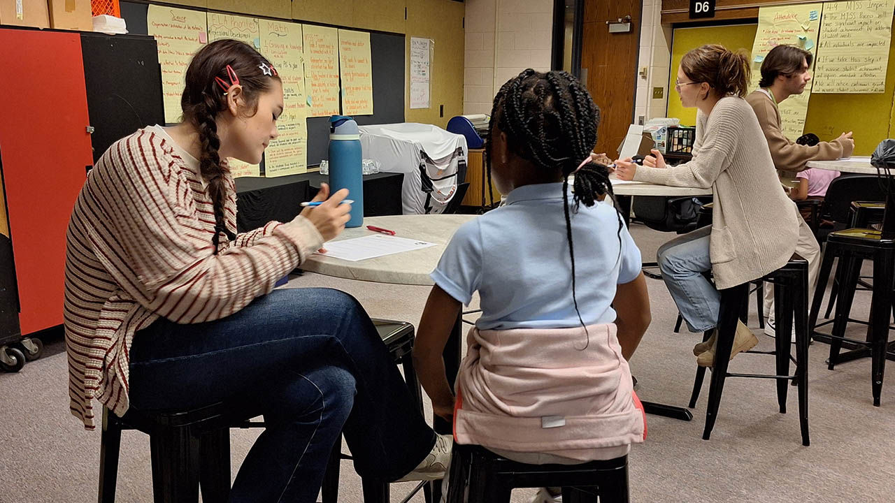 Students in EDUC 220 Family and Community Diversity are paired with fourth graders at Martin Luther King Jr. Elementary School for math tutoring. Submitted photos.