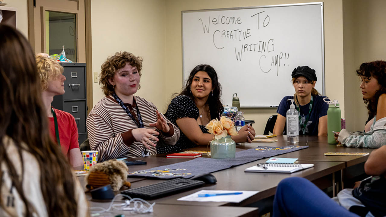 Creative Writing Camp participants engage in conversation during a camp session. Photo | Garret Roberts
