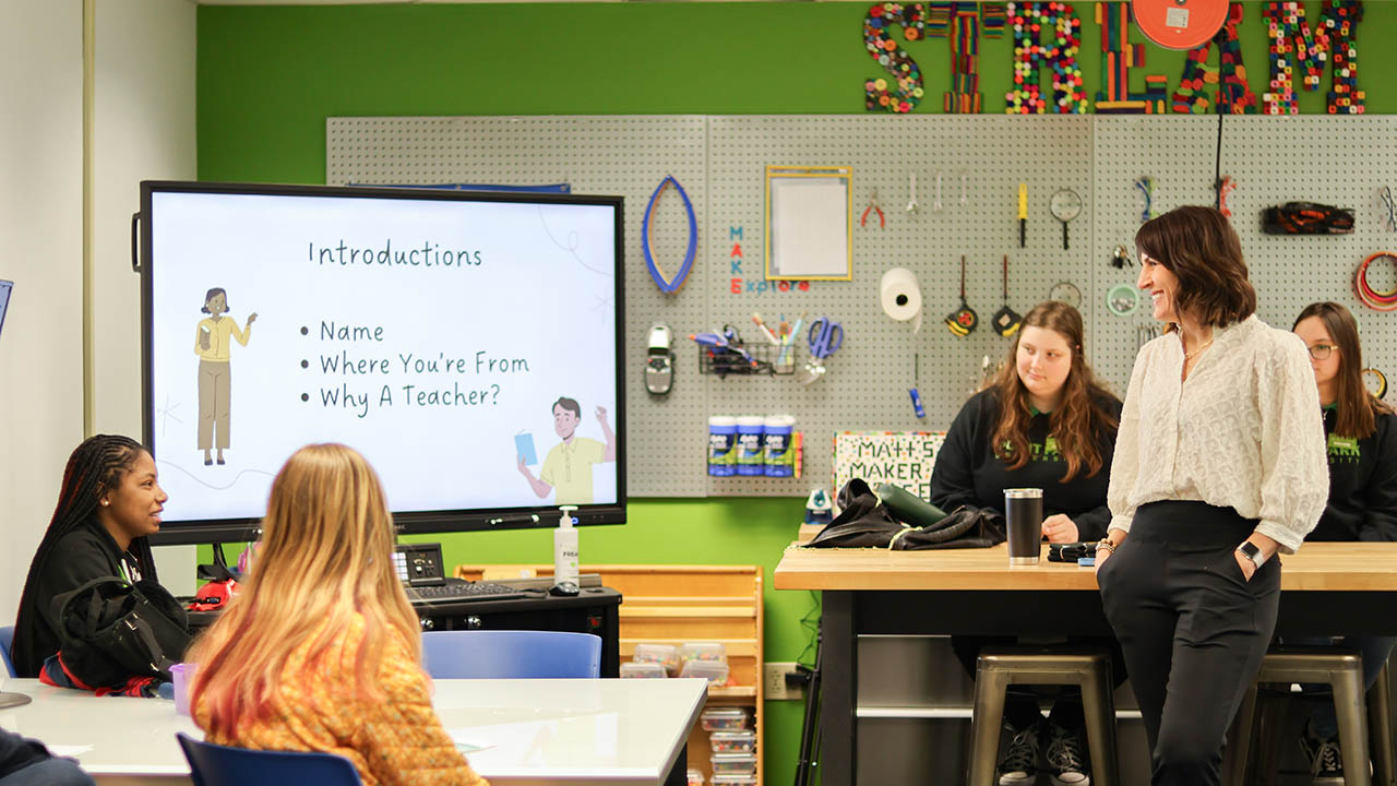 Pictured is Kamryn York teaching a class in Matt's Maker Space on campus. 