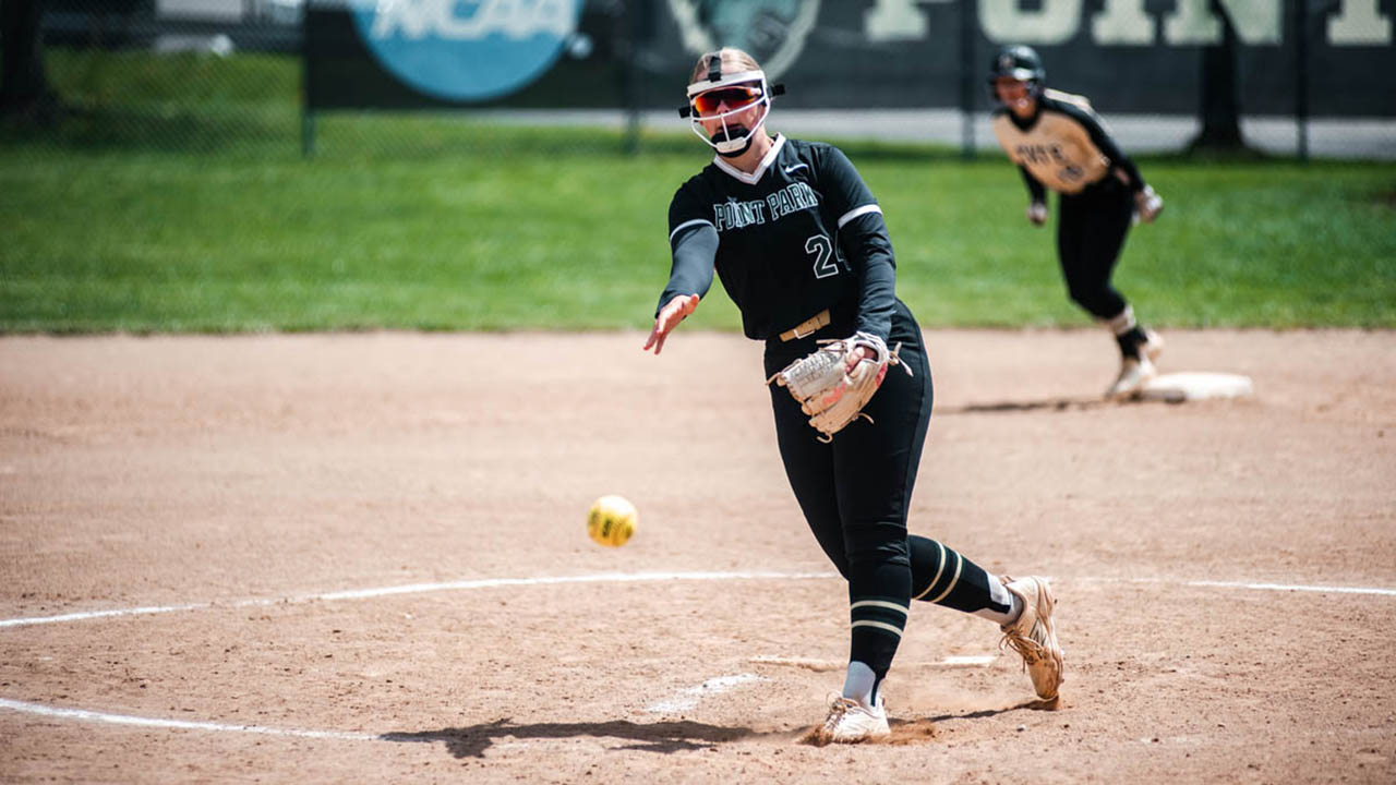 A student-athlete playing softball.