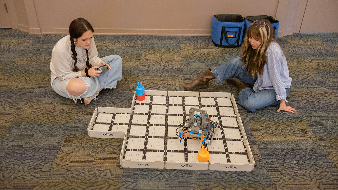 Education majors got hands-on experience with robotics at an innovation presentation. Photo by Chloe Humway '28.