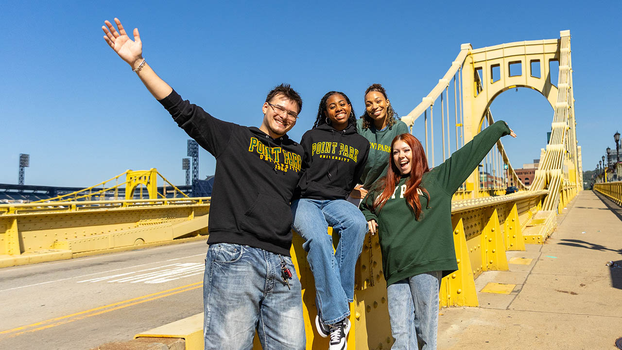 Point Park students wear university apparel and pose in Downtown Pittsburgh. 
