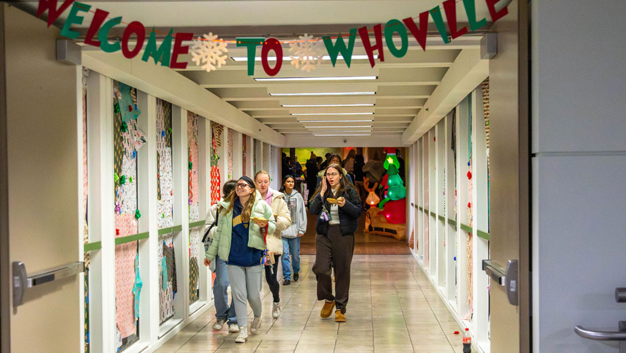Students walk across the decorated skybridge connecting Lawrence Hall and Academic Hall during Whobilation!, a holiday-themed event. Photos by Dakota Nicholson '26.