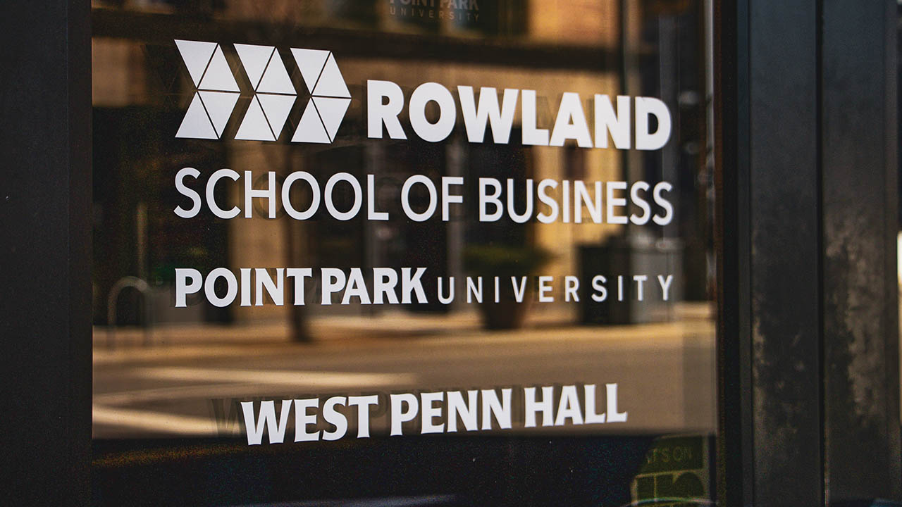 The Rowland School of Business logo. 