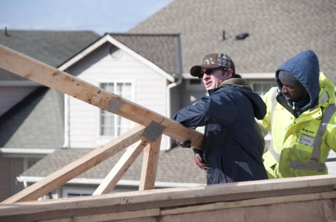 Point Park student Ian Lupo works with Dale Hamilton of East Carolina University on a Habitat home near Tacoma, Washington. | Photo by Kelly Cline