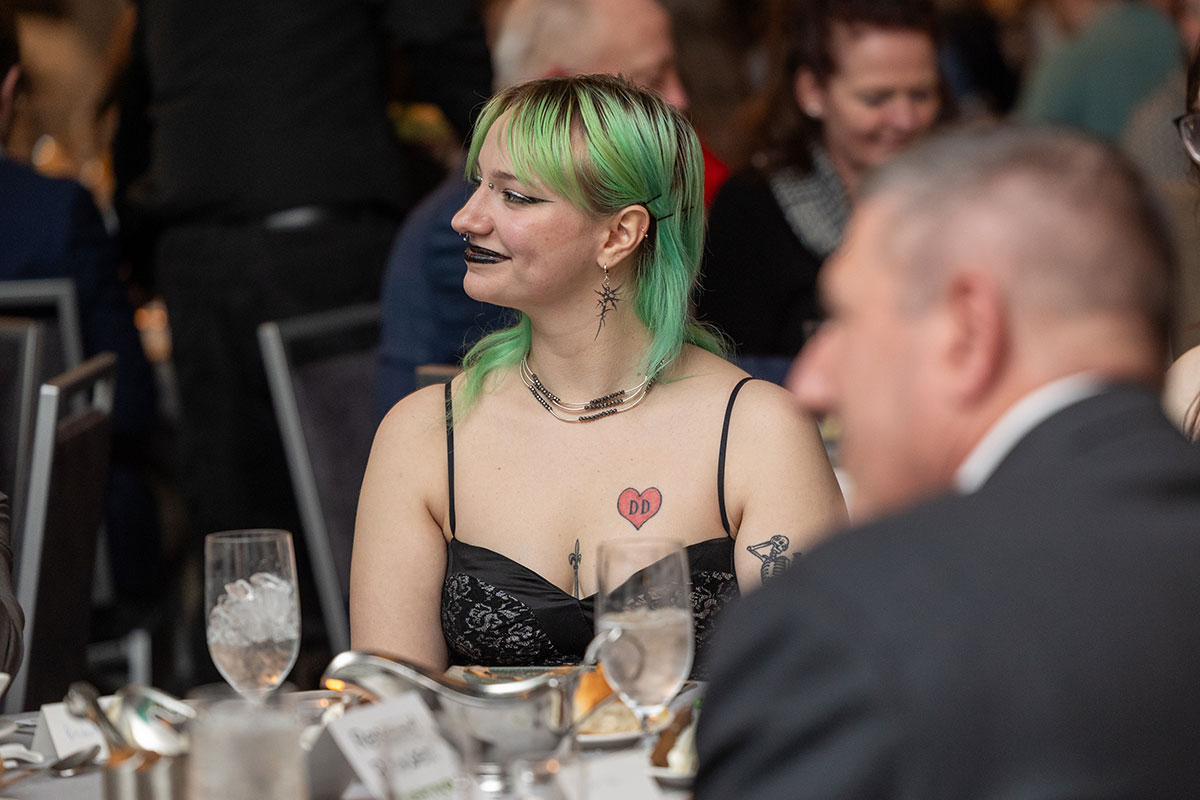 A female student sits at a table.